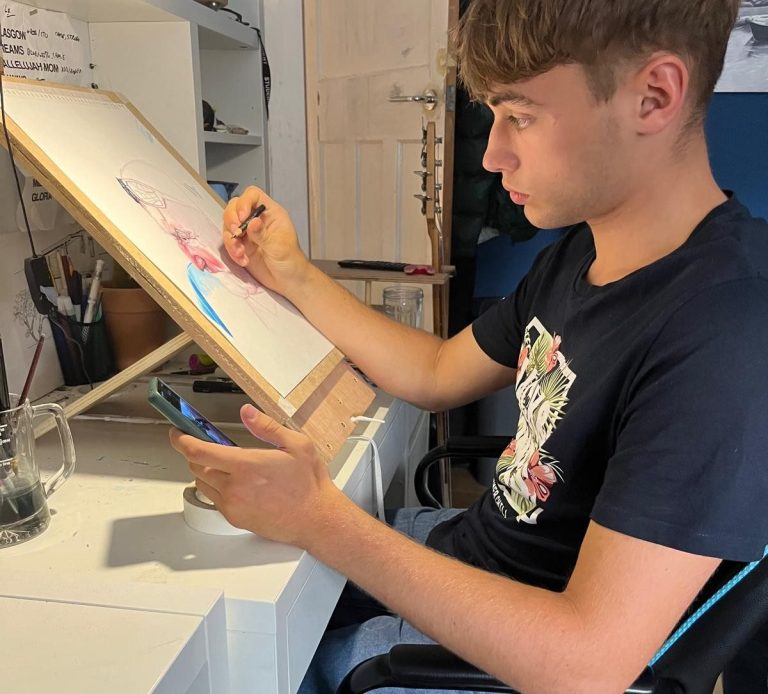 Joel as a young artist, fully focused producing unique artwork.