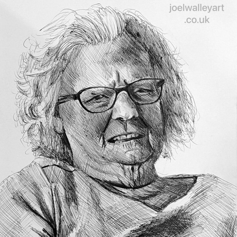Portrait of an elderly woman with glasses, smiling slightly, wearing a textured sweater.